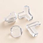 Clear soft silicone corner guards on a neutral background