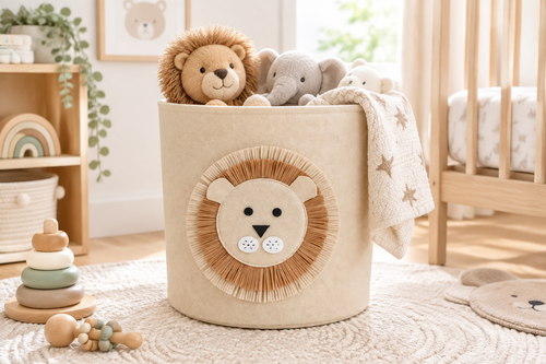 Beige felt lion storage basket in a bright nursery filled with soft toys and a folded blanket