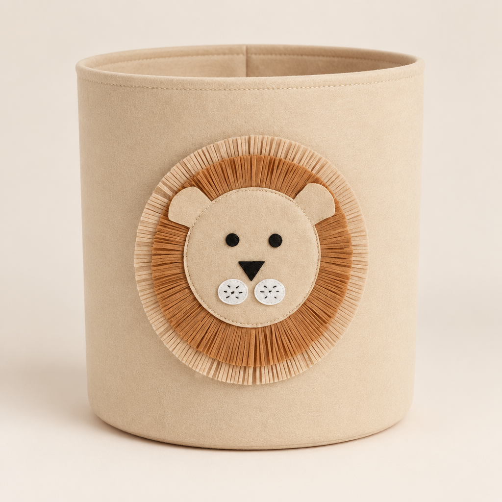 Beige felt storage basket with a lion face applique on a neutral background