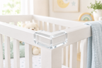 Clear silicone corner guard installed on a white nursery crib corner